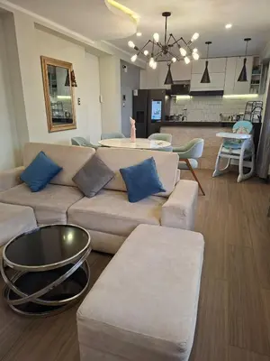 a living room with a couch and a table at Beach House - Besso Beach in Barranca