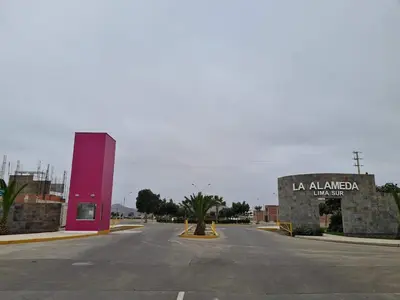 an empty street with a sign on the side of a building at Chilca, ATM Beach House in Salinas