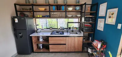 a kitchen with a sink and a refrigerator at Quiet 2BR Villa whit Pool & Games in Ica