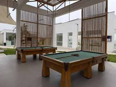 two pool tables in a room with a building at Casa de Playa de Estreno in San Antonio