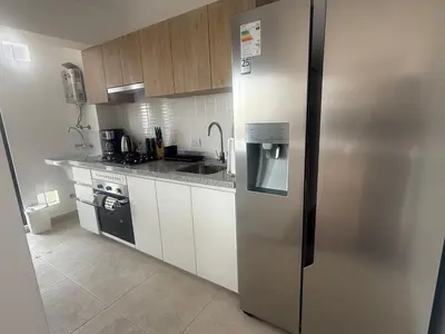 a kitchen with a stainless steel refrigerator and a sink at Miraflores Premium in Lima