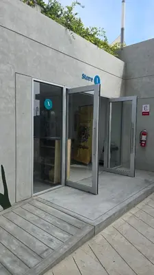 an entrance to a store with two sliding glass doors at Exclusive apartment in San Bartolo in San Bartolo