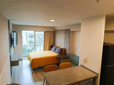 a hotel room with a bed and a window at JAVIER PRADO ESTE 1501 LOFT- FRENTE a SAN BORJA in Lima