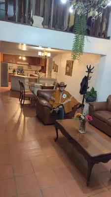 a living room with two couches and a table at Apartamento Plaza de armas de Ayacucho in Ayacucho