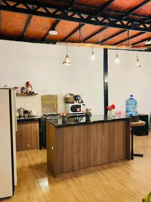 a kitchen with a counter top in a room at Casa La Morada Ecolodge in Ayacucho