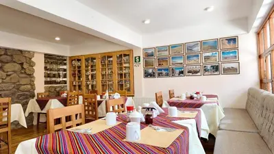 a dining room with tables and chairs in a restaurant at Casa Elena in Cusco