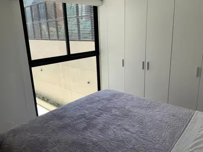 a bedroom with a bed and a window at Modern apartment in Larco 791 in Lima