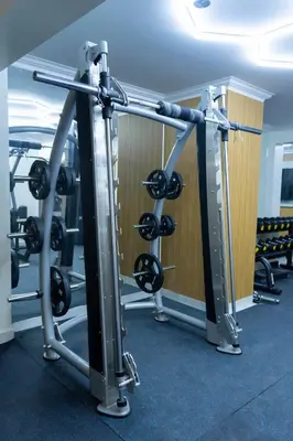a gym with a row of tread machines at Solay Inn in Ayacucho