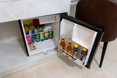 a small refrigerator filled with drinks and alcohol at Solay Inn in Ayacucho