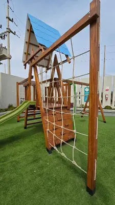 a playground with a net on the grass at Departamento exclusivo en San Bartolo in San Bartolo