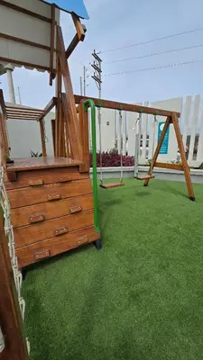 a playground with a green pipe in a yard at Departamento exclusivo en San Bartolo in San Bartolo