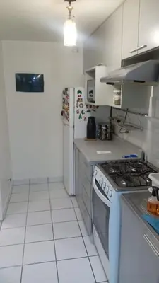 a kitchen with a stove and a refrigerator at Welcome to this apartment Pet friendly in Lima