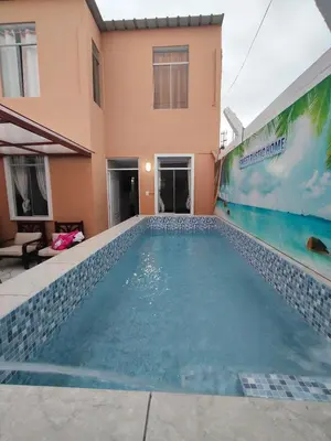 a swimming pool in front of a house at Sweet Rustic Home in Salinas