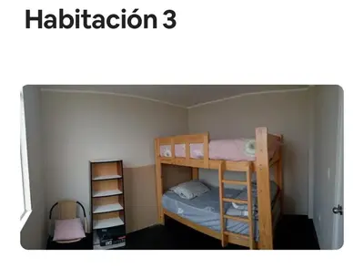 a small room with two bunk beds and a ladder at Sweet Rustic Home in Salinas