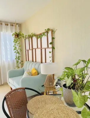 a living room with a couch and some plants at Encantadora casa en Menorca - Ica in Ica