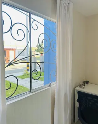 a window with a view of a street at Encantadora casa en Menorca - Ica in Ica