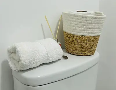 a towel and a basket on a bathroom counter at Encantadora casa en Menorca - Ica in Ica
