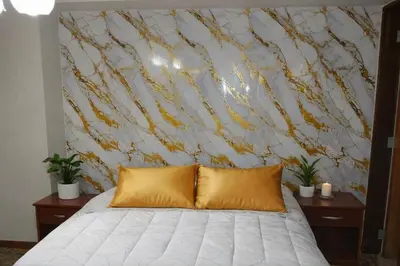 a bedroom with a bed with a large wall mural at Modern y Cozy Apartment Prime Location Fast WiFi in Lima