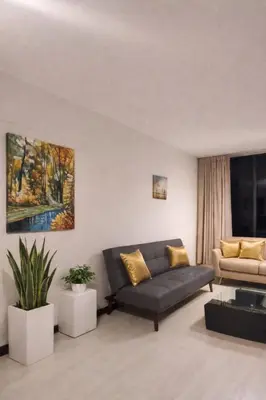 a living room with a couch and a table at Modern y Cozy Apartment Prime Location Fast WiFi in Lima