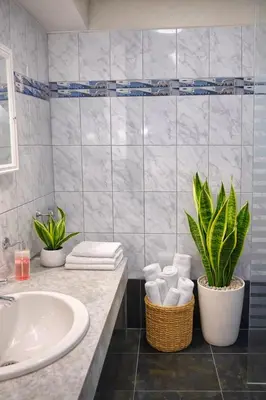 a bathroom with a sink and a plant in it at Modern y Cozy Apartment Prime Location Fast WiFi in Lima