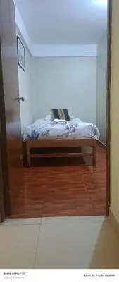 a bedroom with a bed in the corner of a room at AMARU Palace in Machu Picchu