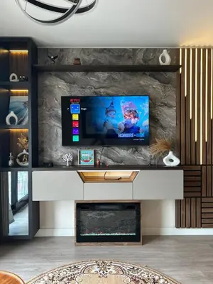 a living room with a tv and a fireplace at Luxury Ocean View Barranco Apt, 17th Floor AC in Lima