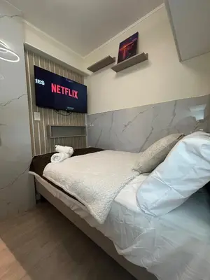 a bedroom with a bed with a sign on the wall at Luxury Ocean View Barranco Apt, 17th Floor AC in Lima