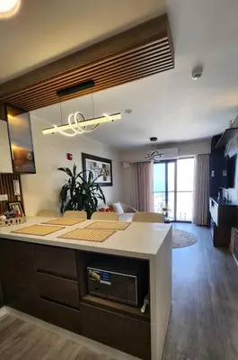 a kitchen and living room with a large island in a room at Luxury Ocean View Barranco Apt, 17th Floor AC in Lima
