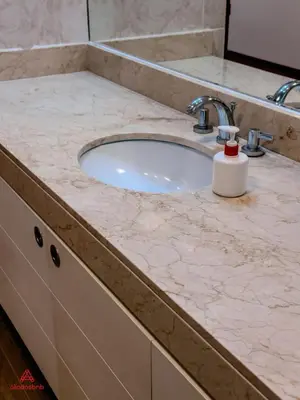 a bathroom counter with a sink with a soap dispenser on it at Cozy Retreat in the Heart of Surco in Lima