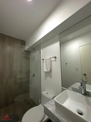 a bathroom with a toilet and a sink and a shower at Fantastic 1BR at Barranco in Lima