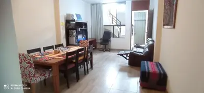 a living room with a dining room table and chairs at CHANCAY- 1er PISO DEPARTAMENTO in Chancay