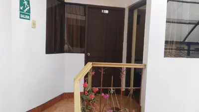 a door with a cage with flowers in it at San Blas B&B in Cusco