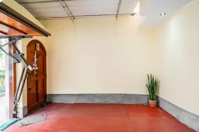 an empty room with a door and a plant at Equipped Loft with Sofa Bed and Balcony in Lima
