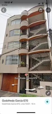 a building with balconies on the side of it at Las palmeras in Lima