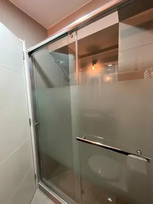 a glass shower in a bathroom with at Oceanfront apartment, Pool, Gym, Sauna, Arcade in Lima