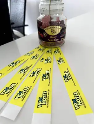 a jar of jam sitting on a table with yellow tape at Sarapampa punto Asia in Asia