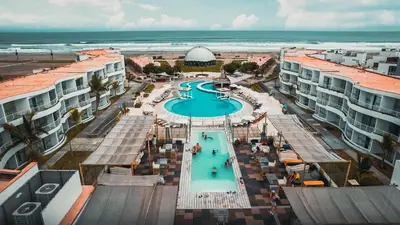 an aerial view of a swimming pool at the beach at Sarapampa punto Asia in Asia