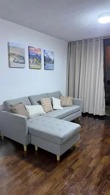 a living room with two couches and a couch at Renovado departamento completo cerca a aeropuerto y pucp in Lima