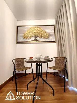 a table and two chairs in a room at Casa Cayena in Lima