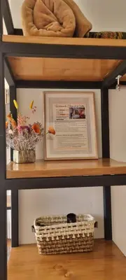 a shelf with a picture and a basket on it at Florez de la Villa Apart Hotel in Cusco