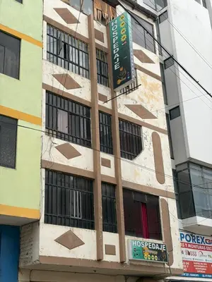 a building with a sign on the side of it at Hospedaje Tarapacá in Huancayo