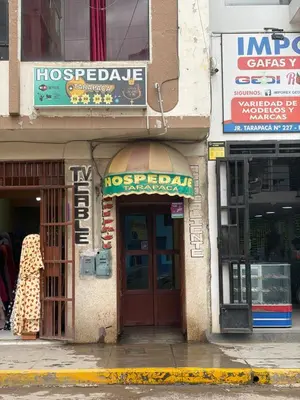 a store front of a building on a city street at Hospedaje Tarapacá in Huancayo