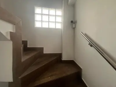 a stairway with a window and a stair case at Ministery The Bleasing in Lima