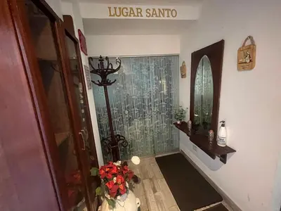 a hallway with a walk in shower in a home at Ministery The Bleasing in Lima