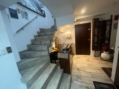a hallway with a stairway with a stair case at Ministery The Bleasing in Lima
