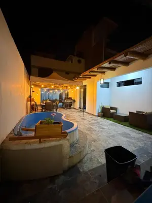 a large tub in a patio at night at Casa de playa in Arica
