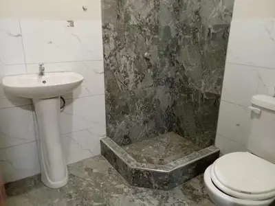 a bathroom with a sink and a shower with a toilet at Excellent house in Quilmana in Quilmaná
