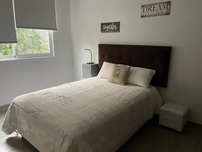 a bedroom with a large bed with a pillow on it at Casa de Campo Quives Majestuoso 5BR in Santa Rosa de Quives