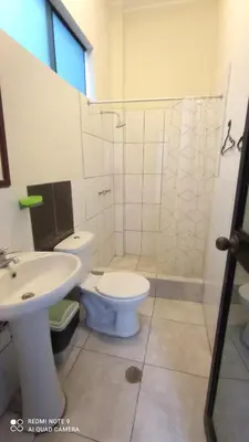 a bathroom with a toilet and a sink at CHANCAY 1er Piso Como en Casa in Chancay