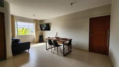 a living room with a table and a couch at Apartment in San Bartolo - Playa Norte in San Bartolo